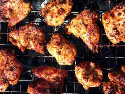 photo of barbequed chicken on a grill; keto diet for beginners.