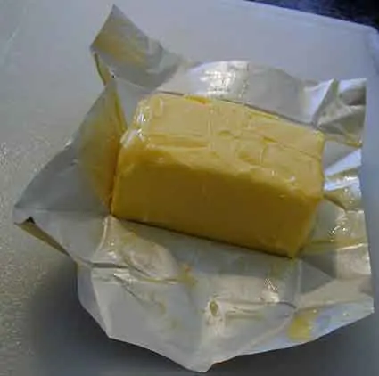 photo of a packet of butter that has been opened to reveal the butter inside; Keto diet for beginners.