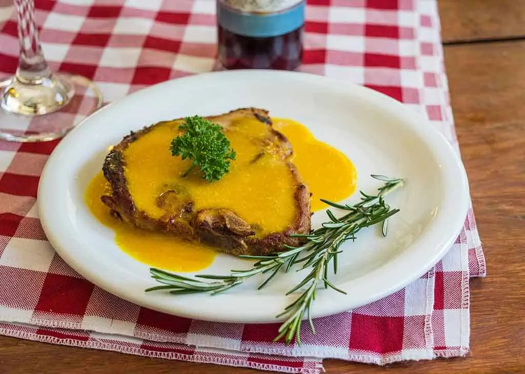 photo of steak with butter sauce, a keto meal;