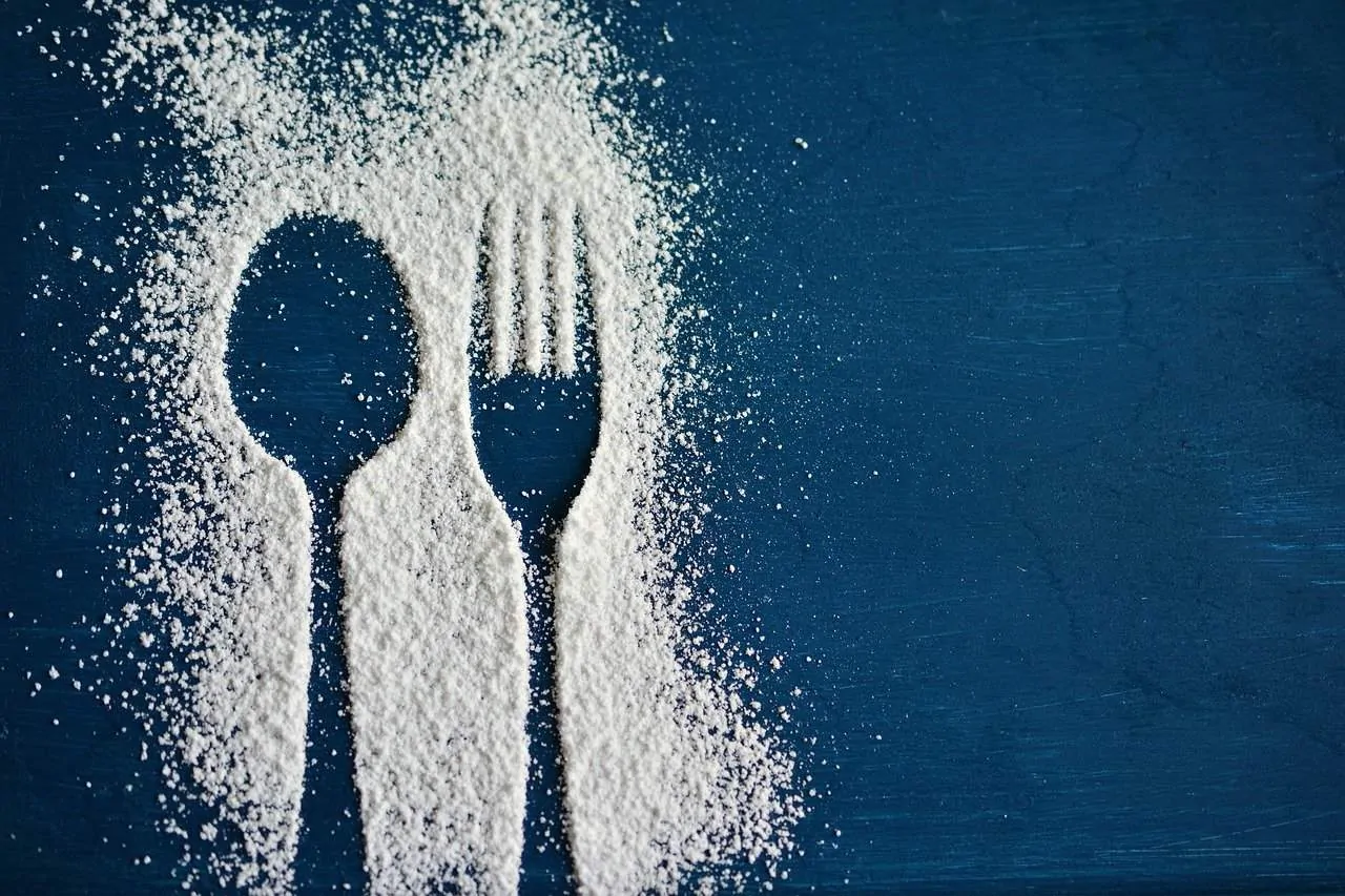 photo of sugar with an impression of a knife and fork.