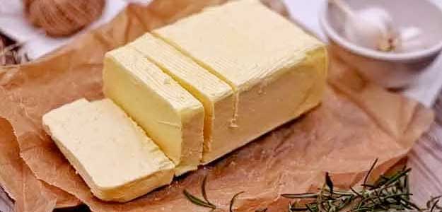 photo of a block of butter on a board; best dairy foods on a keto diet.
