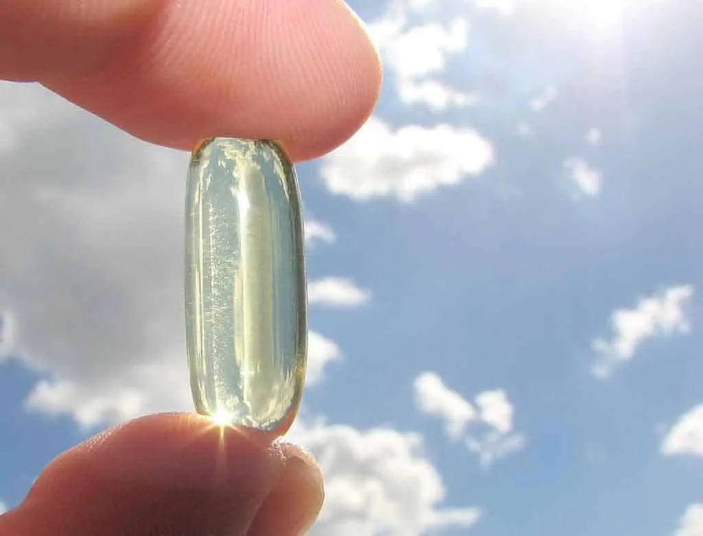 photo of vitamin d capsule against sky.