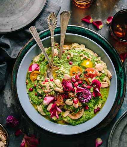 photo of a salad with guacamole on top, a keto friendly meal;