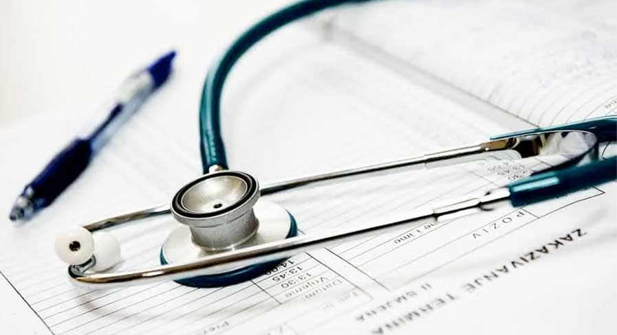 photo of doctor equipment and appointment book: Coimbra vitamin D protocol.